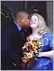 The Groom kisses his happy wife.