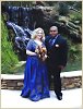 The happy couple pose one last time by the waterfall.